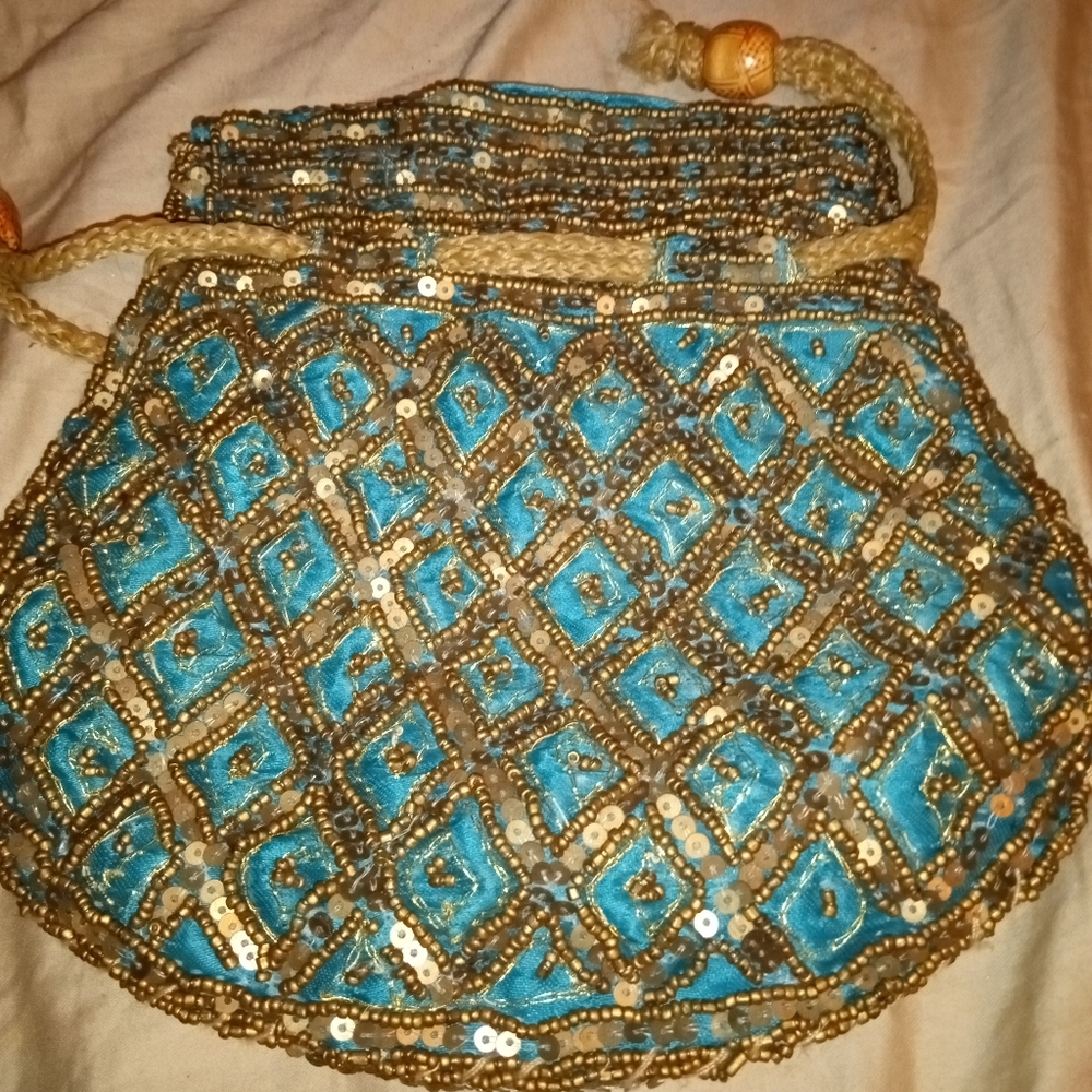 NWOT.  DT Potli turquoise embroided bag.
